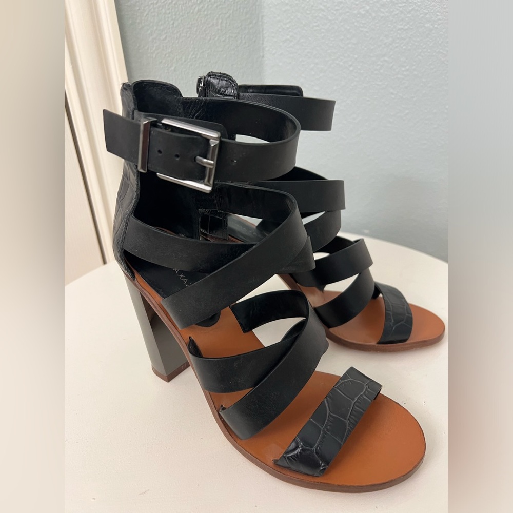 BCBG Max Azria black leather strappy sandal with chunky metallic heel. Size 8M.